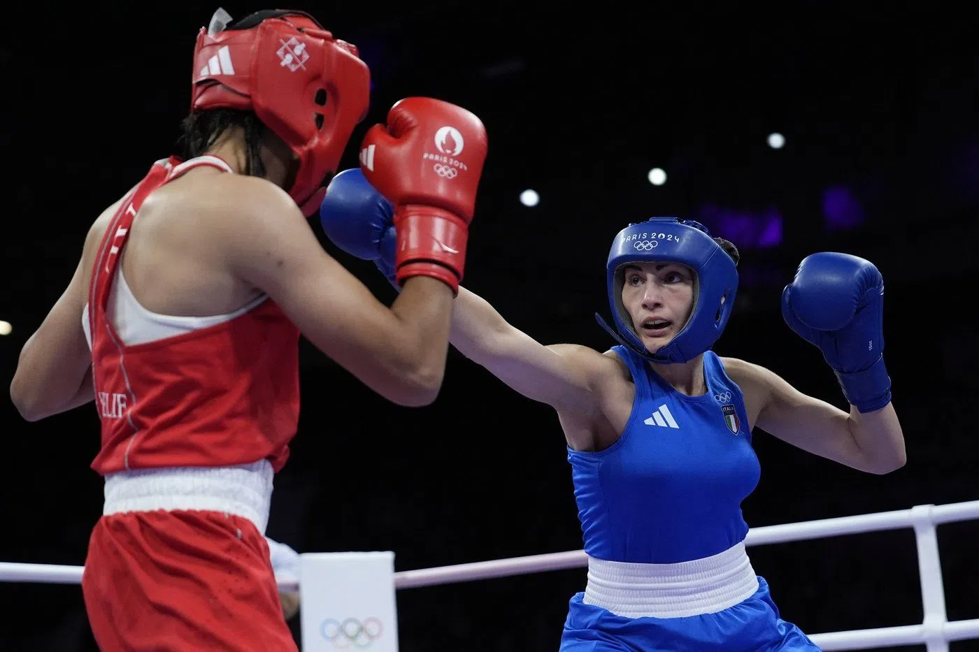 Algeria's Imane Khelif, left, fights Italy's Angela Carini in their women's 66kg preliminary boxing match at the 2024 Summer Olympics, Thursday, Aug. 1, 2024, in Paris, France. (AP Photo/John Locher)