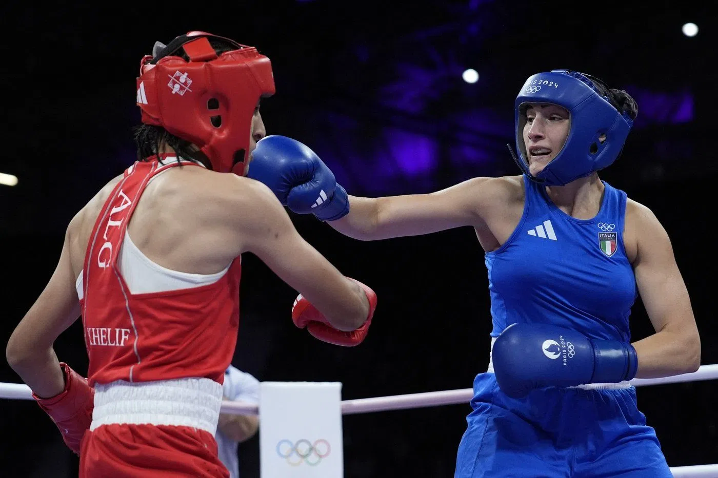 Algeria's Imane Khelif, left, fights Italy's Angela Carini in their women's 66kg preliminary boxing match at the 2024 Summer Olympics, Thursday, Aug. 1, 2024, in Paris, France. (AP Photo/John Locher)