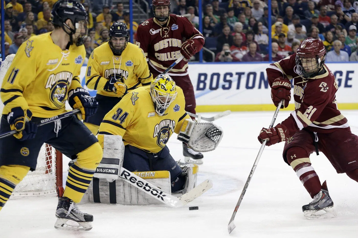 FILE - Quinnipiac goalie Michael Garteig (34) makes the save on a shot by Boston College forward Matthew Gaudreau (21) during the first period of an NCAA Frozen Four semifinal NCAA college hockey game Thursday, April 7, 2016, in Tampa, Fla. (AP Photo/Chris O'Meara, File)