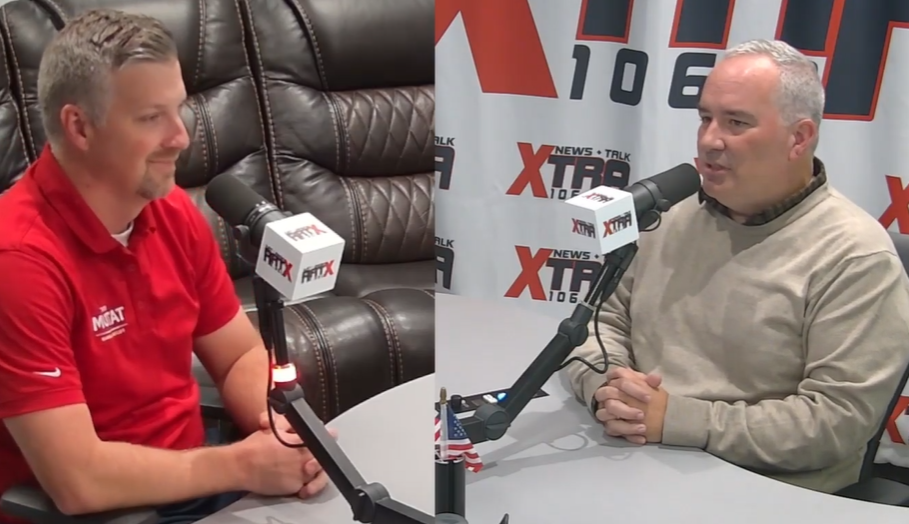 Fulton County Commission Chairman candidate Eric Tatum (L) explains his positions with Ben Burnett in the XTRA106.3FM studio. (Photo: XTRA106.3FM)