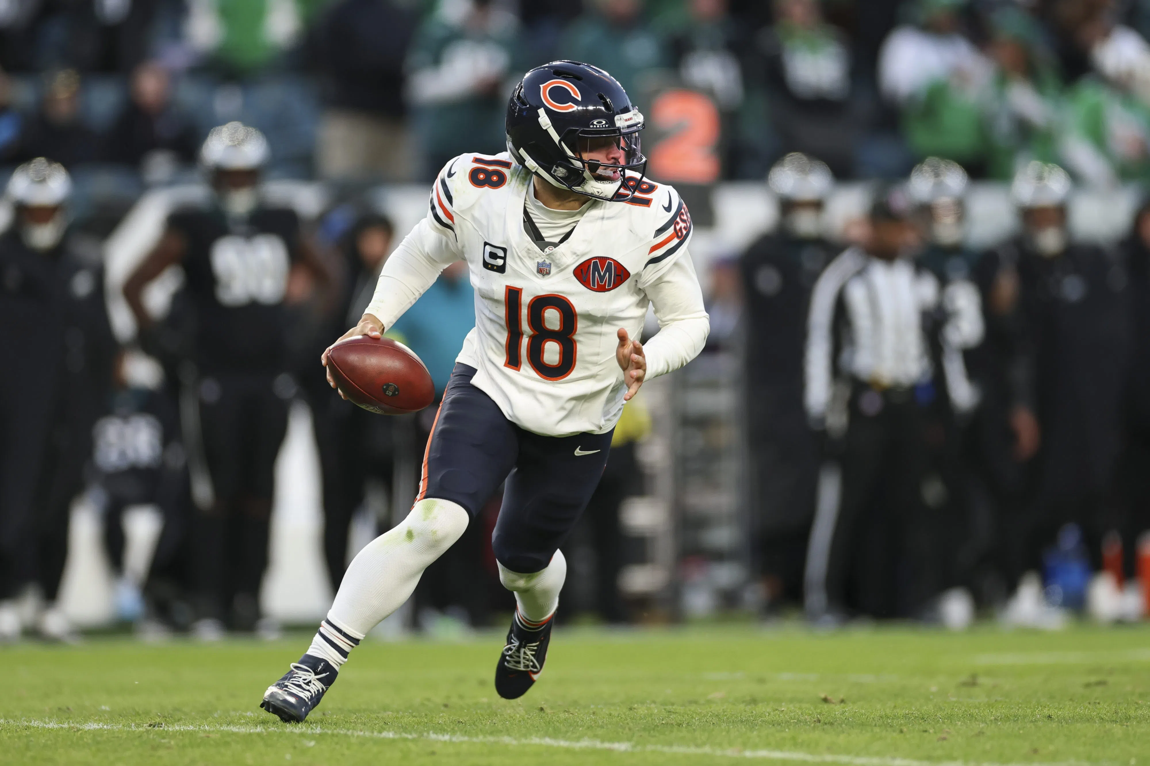 PHILADELPHIA, PENNSYLVANIA - NOVEMBER 28: Caleb Williams #18 of the Chicago Bears rolls out to throw a pass during the second quarter of an NFL football game against the Philadelphia Eagles at Lincoln Financial Field on November 28, 2025 in Philadelphia, Pennsylvania. (Photo by Logan Bowles/Getty Images