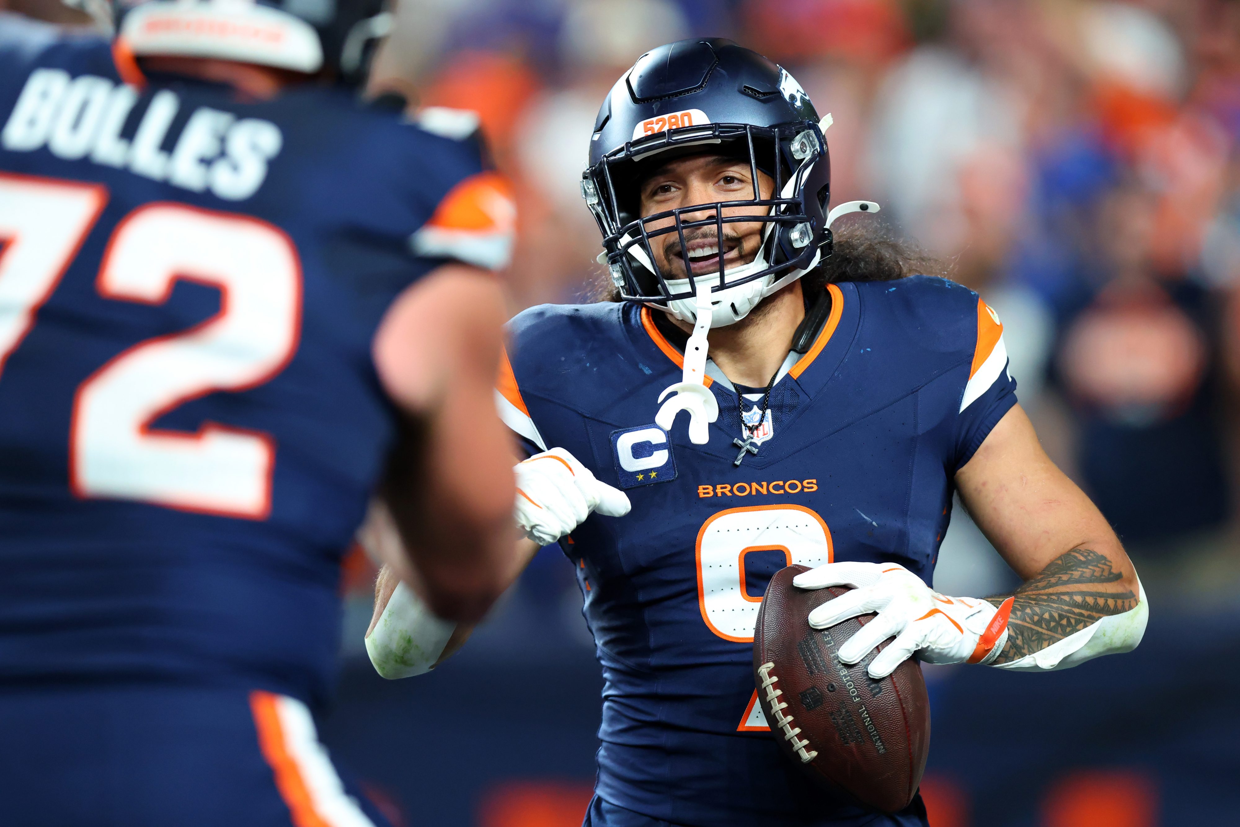 DENVER, COLORADO - SEPTEMBER 27: Talanoa Hufanga #9 of the Denver Broncos celebrates an interception for a touchdown against the Los Angeles Rams during the fourth quarter at Empower Field At Mile High on September 27, 2026 in Denver, Colorado. (Photo by Justin Edmonds/Getty Images)