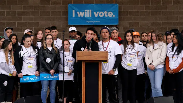 Carlos Rodriguez speaking at teen voter registration rally