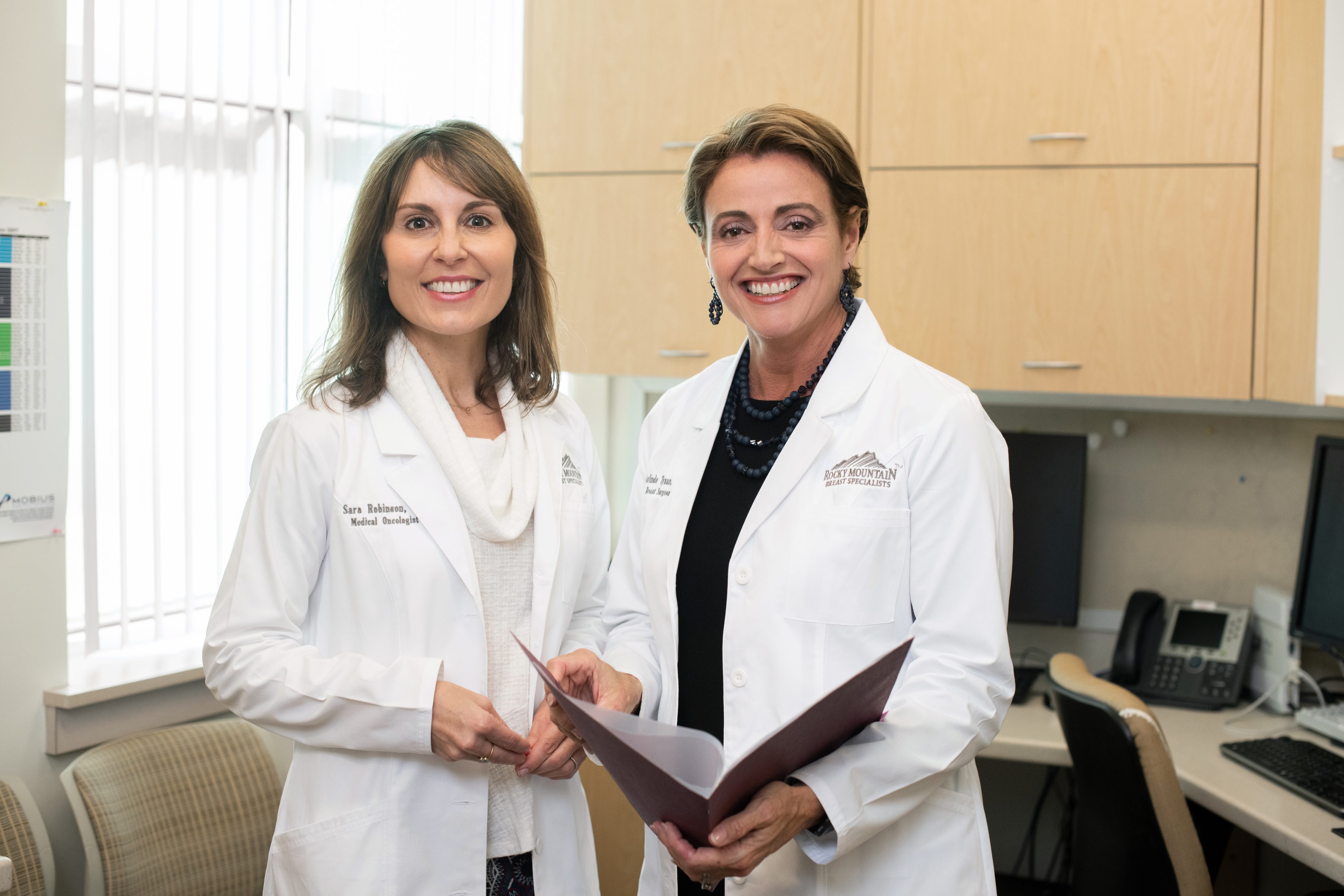 RMCC physicians Sara Robinson, medical oncologist, and colleague from Rocky Mountain Breast Specialists