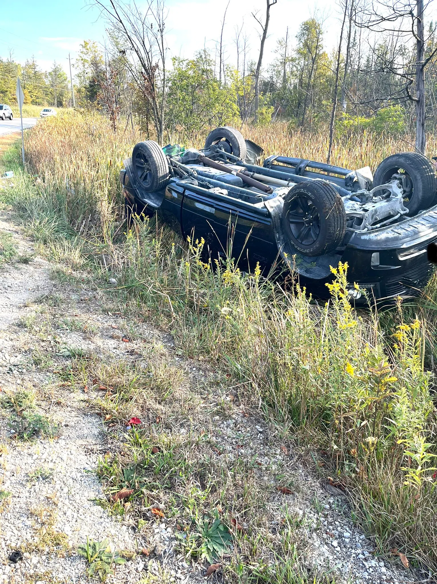 Driver walks away without serious injury after vehicle flips over in Milton