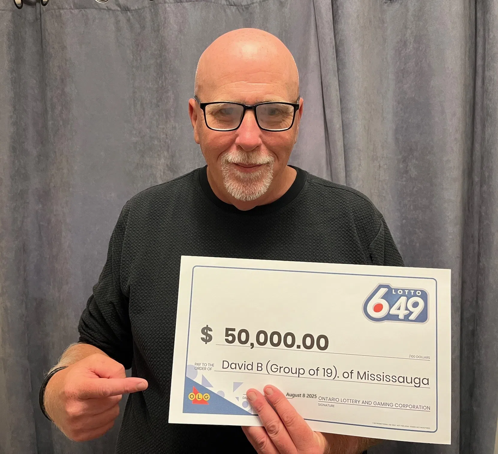 Georgetown man among group of 19 splitting lottery win