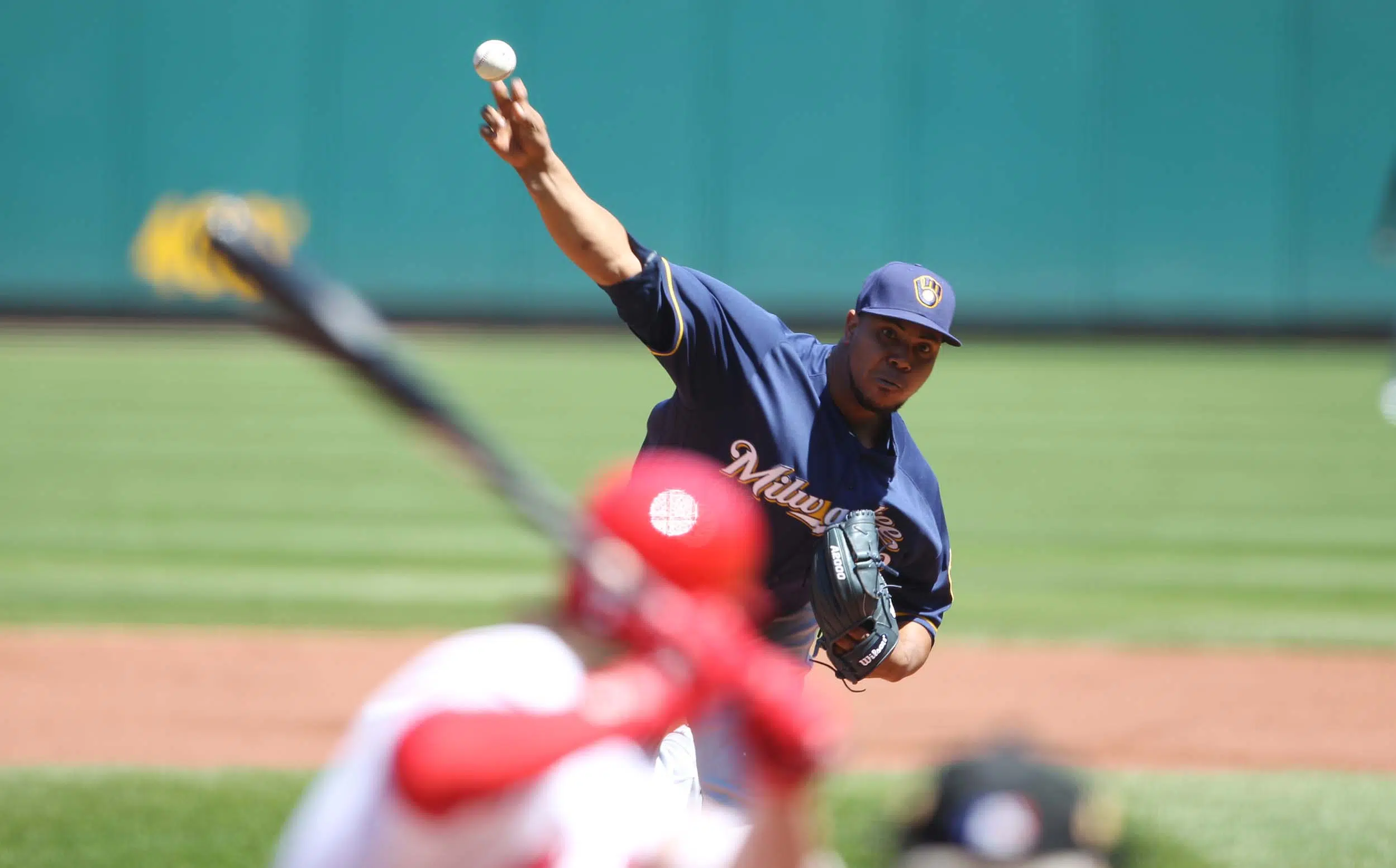 Peralta leads Brewers to first win of the season