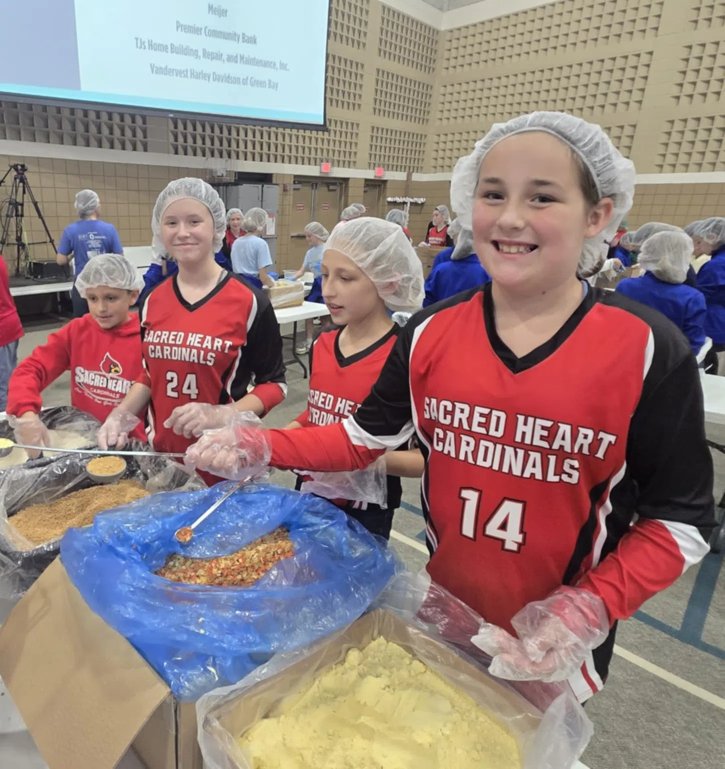 Sacred Heart Catholic Students Volunteer at Feed My Starving Children Event