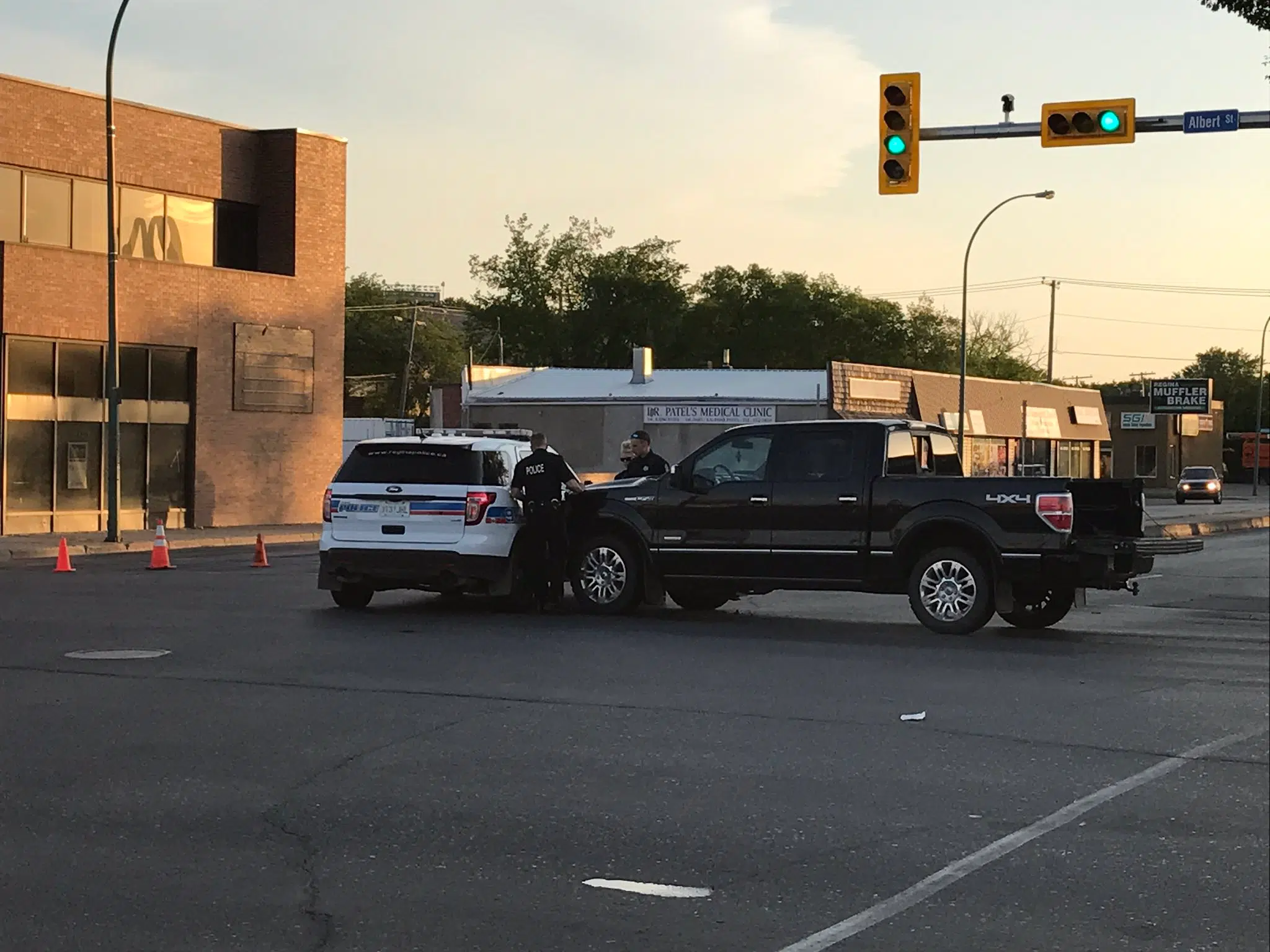Regina police SUV hit, man charged with failing to yield