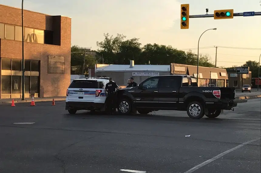 Regina police SUV hit, man charged with failing to yield
