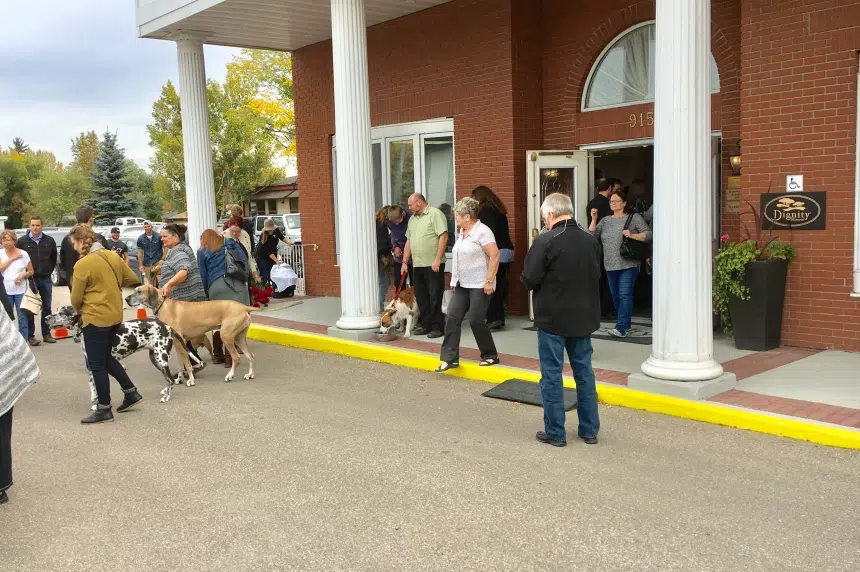 Pet lovers come out to pay respects for 14 dogs at funeral service
