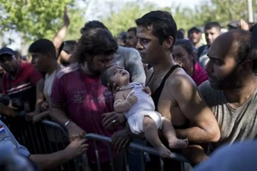 Croatia staggers as 8,900 migrants enter; some trampled in chaotic rush to get buses, trains