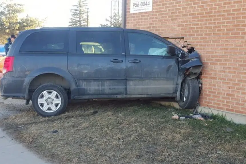 Man arrested after minivan crashes into apartment building in Saskatoon