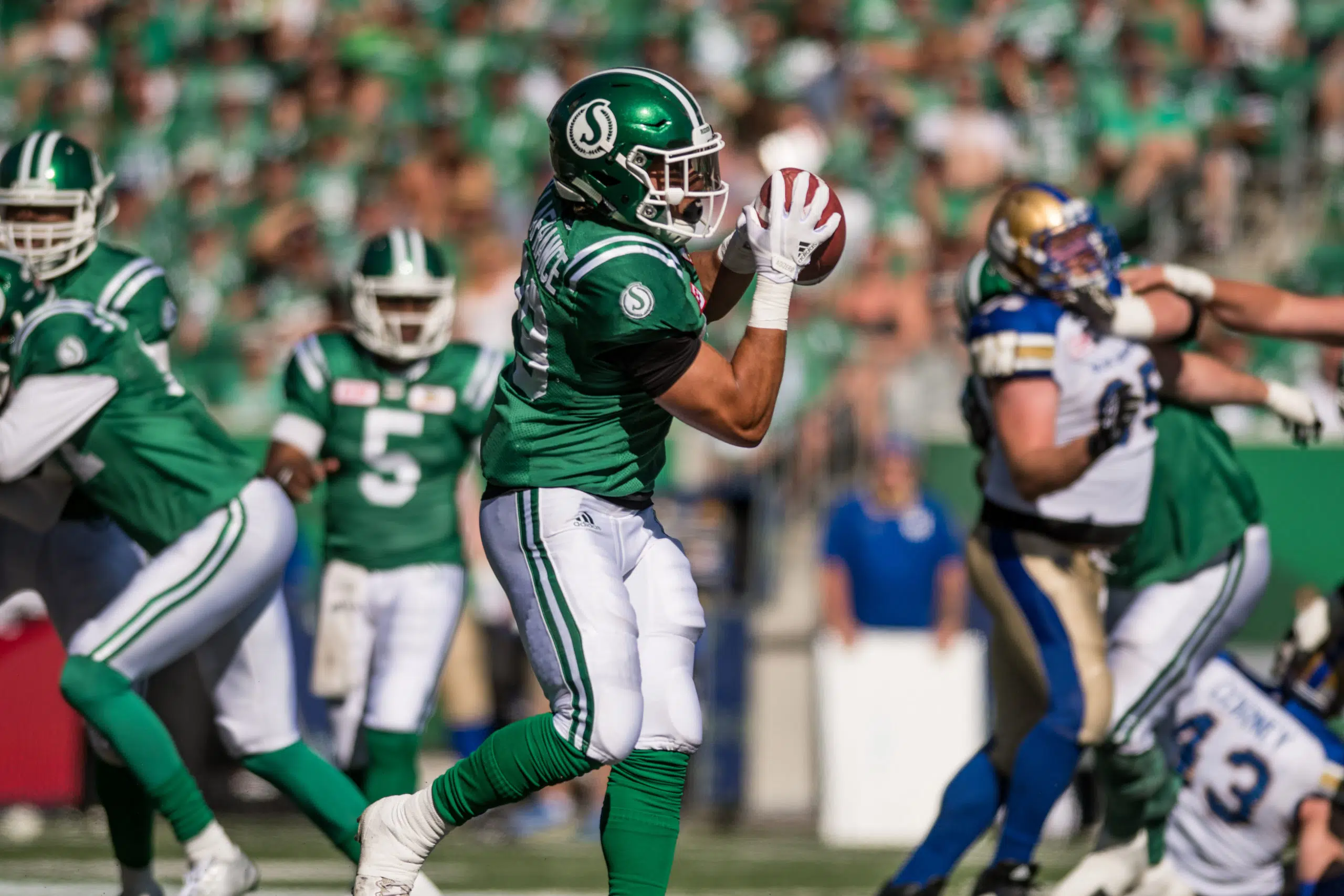 Riders re-sign two Canadians, add offensive lineman to roster