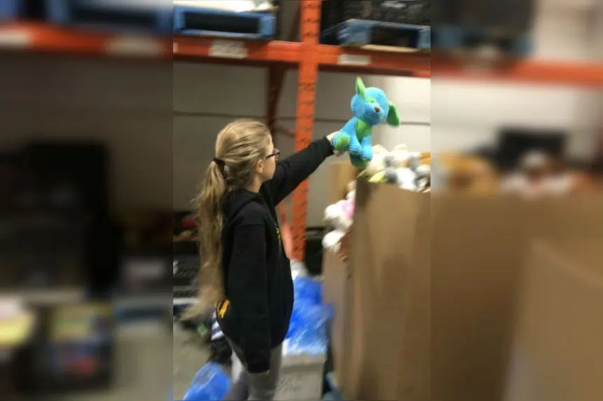 Students sort toys ahead of Santas Anonymous Wrap Day