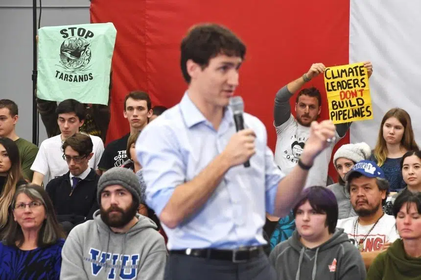 Critics of Kinder Morgan pipeline shout down Trudeau at B.C. town hall