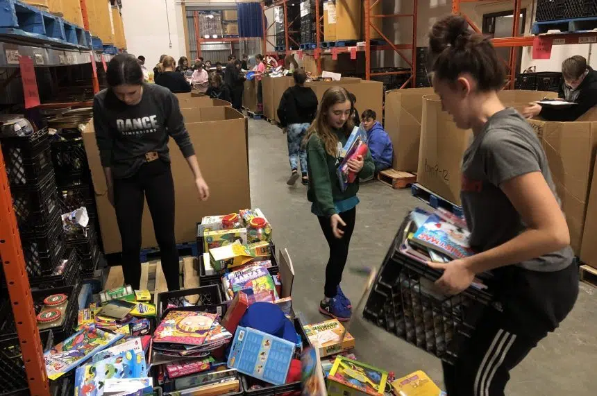 Regina students sort donated toys for 980 CJME's Santas Anonymous
