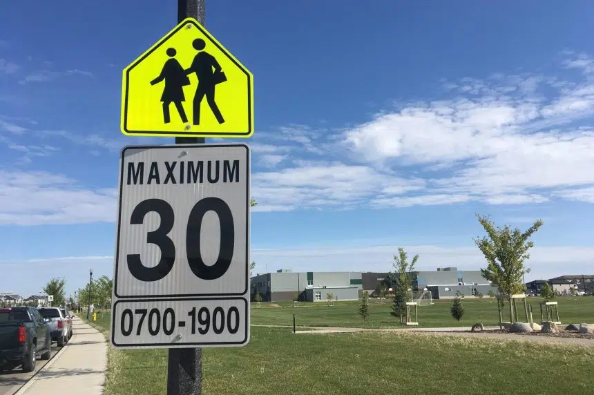 Parents giving a thumbs up to new slower school zones