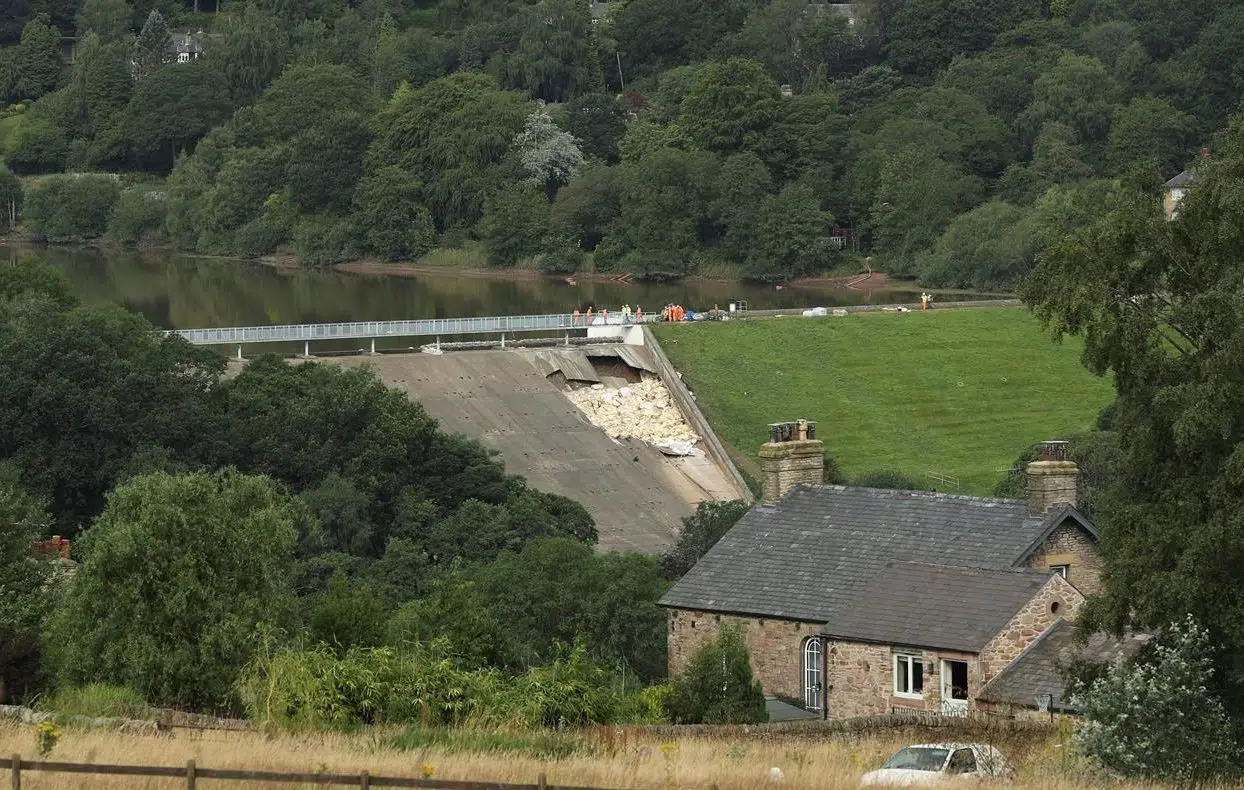UK emergency workers race to cut water levels at damaged dam