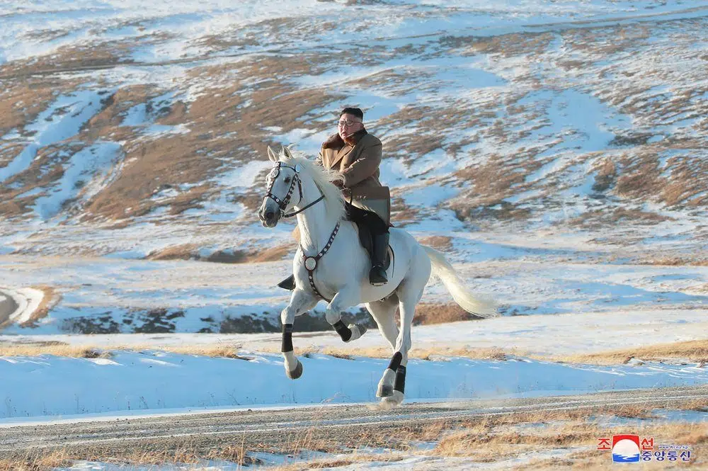 Kim rides horse on sacred peak, vows to fight US sanctions