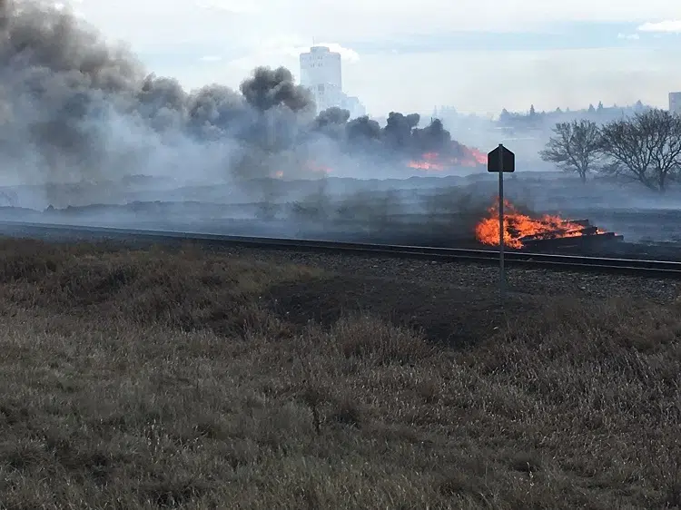Moose Jaw firefighters, police put out two large grass fires