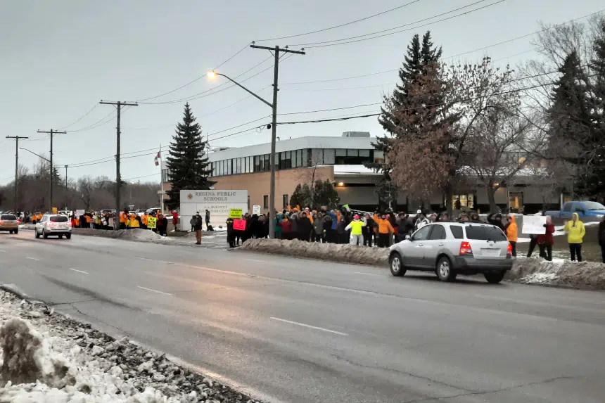 Anti-vaccine protest fills sidewalk outside school division office