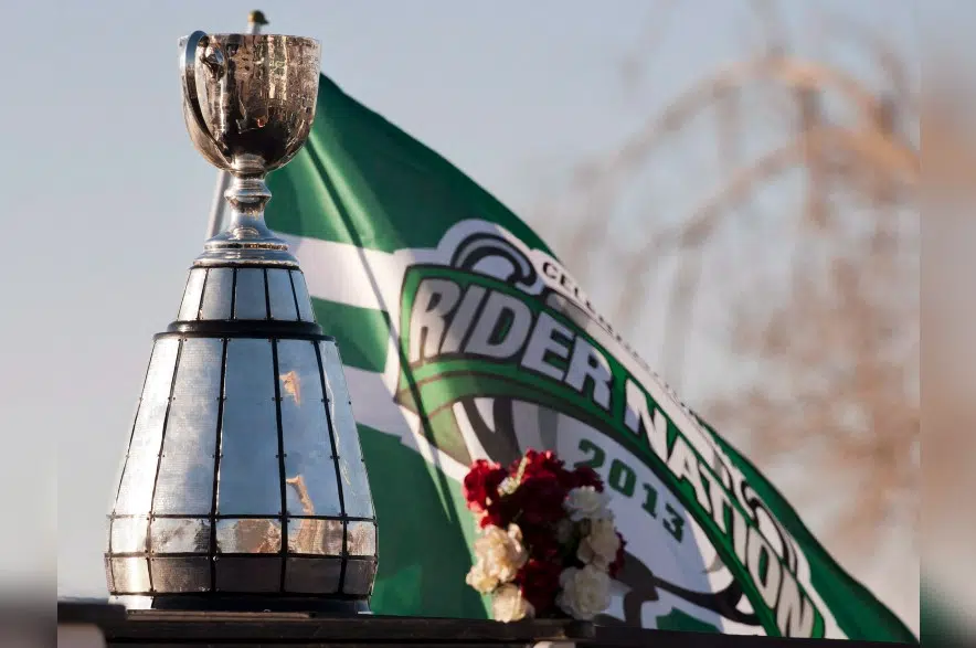 2013 Grey Cup-winning team, Wendy Kelly going into Riders' Plaza of Honour