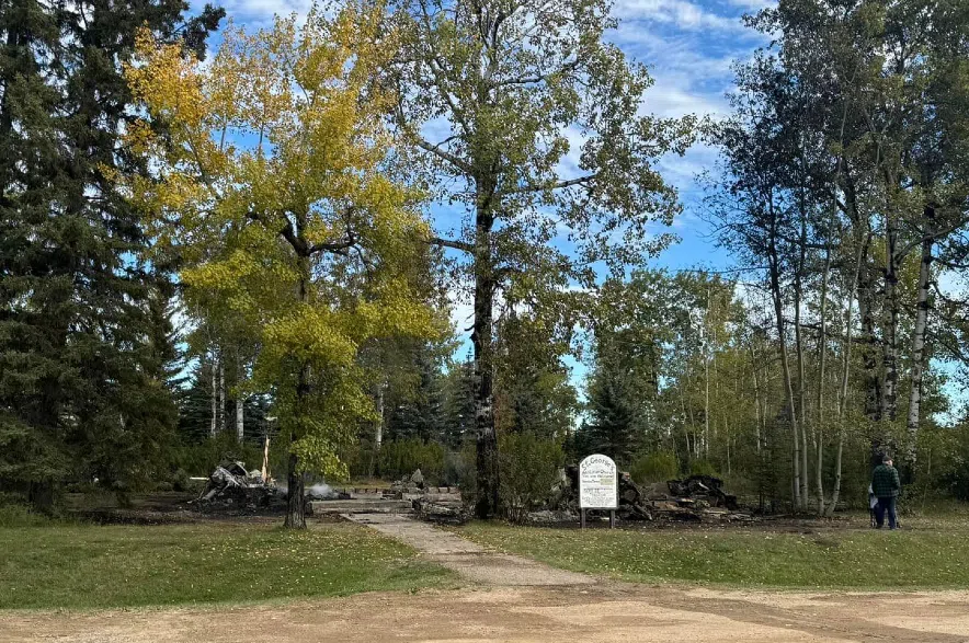 The charred ruins of St. George Anglican Church in Loon Lake