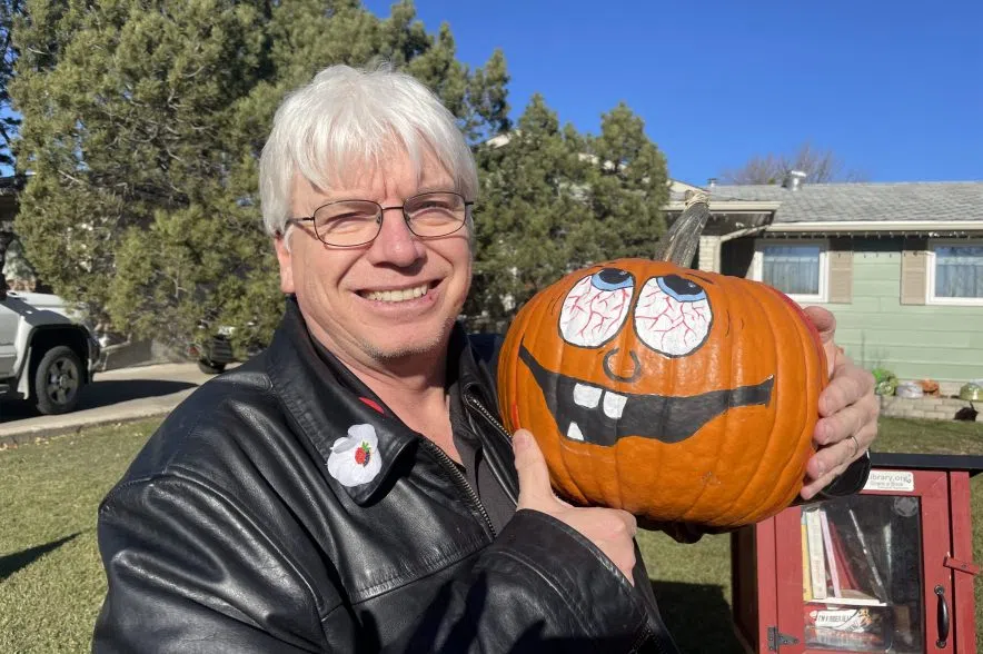 Kelly Woloshin holds a pumpkin