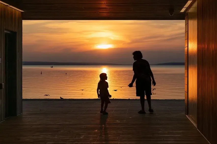 Sihouette of two people at sunset