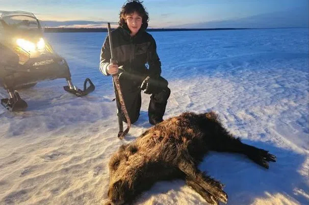 Hunter and wild pig.