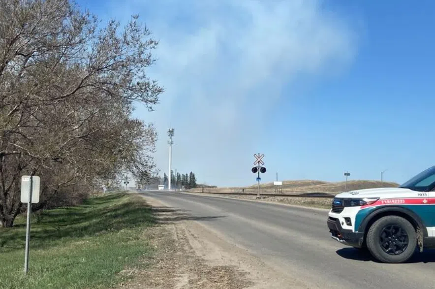 Grass fire near refinery.