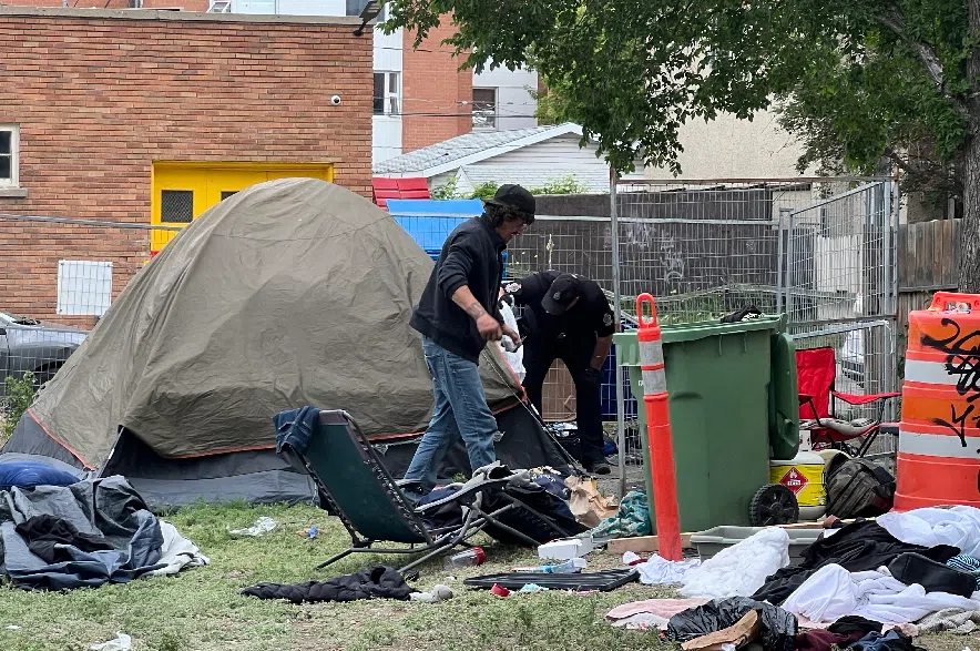 A Regina police officer was checking in on people living at the encampment on Tuesday, making sure they were OK.