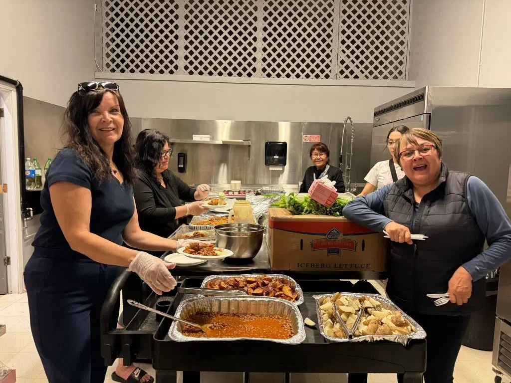 Kitchen staff and volunteers always have a smile on their face while helping evacuees. (Tommy Bird/submitted)