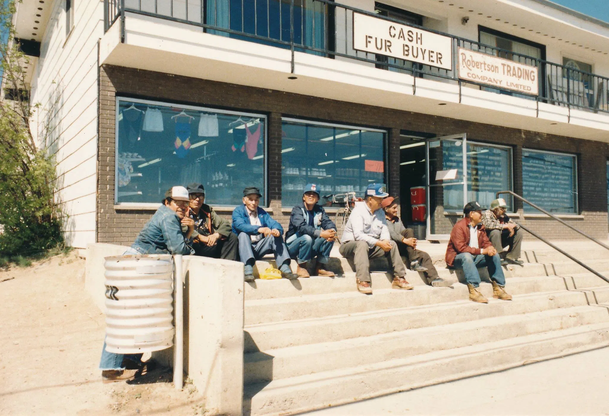 A photo of some local men in La Ronge on the front steps of Robertson Trading (Robertson Trading Memories/Facebook)