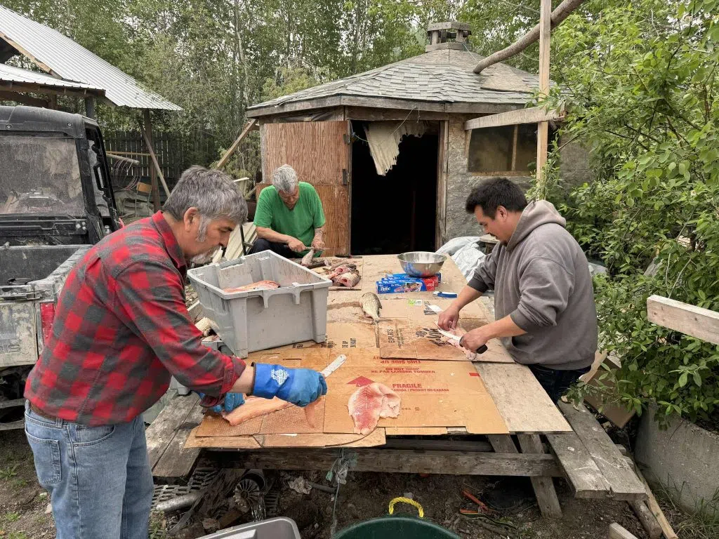 Tommy Bird (left) Elder Lawrence Adam (middle) and Rodd Cook preparing the fish. (Tommy Bird/submitted)