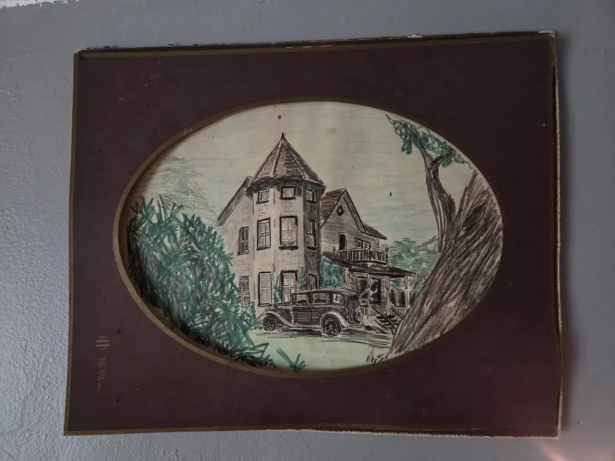 Sketch of the McDonald House featuring turret, wraparound porch, and vintage car