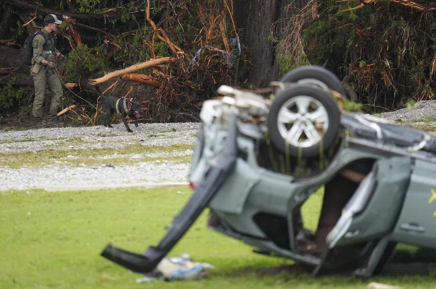 Overturned car and searcher.