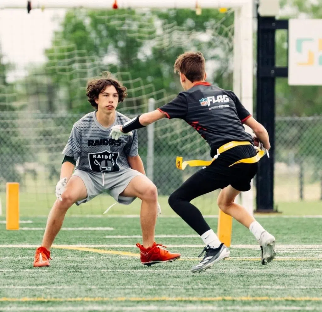 Simon Bunka (left) closing in on a receiver to make one of his many stops on defense. (Jakub Kostura/RYFFL)