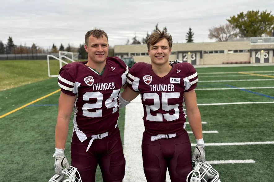 Regina Thunder defenders Kenten and Owen Effa celebrate a defensive stop during the Prairie Football Conference semifinal at Leibel Field.