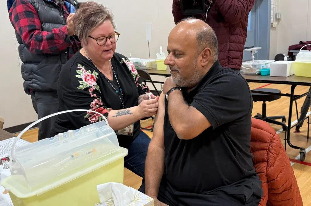Chief Medical Health Officer, Dr. Saqib Shahab, rolled up his sleeves to get his flu and COVID immunization shots.