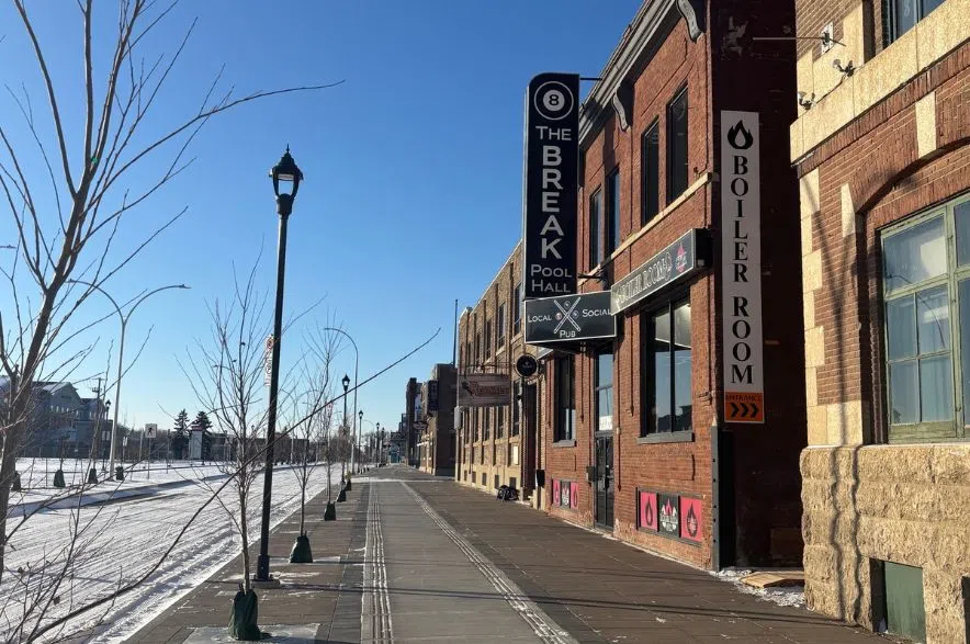 A newly rebuilt section of Dewdney Avenue in Regina’s Warehouse District, with fresh sidewalks, young trees and The Break Pool Hall visible on the right.
