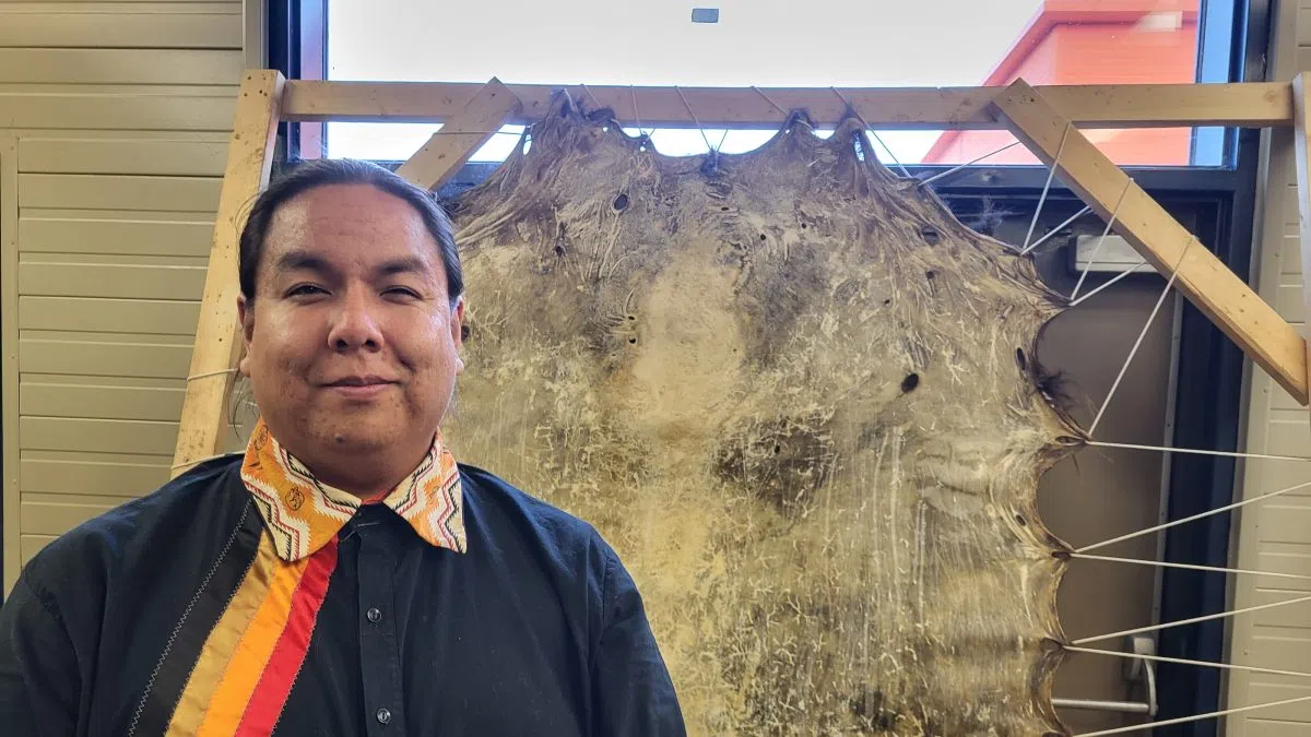 ‘Hard work’: Agribition booth teaches visitors how to scrape Buffalo hide