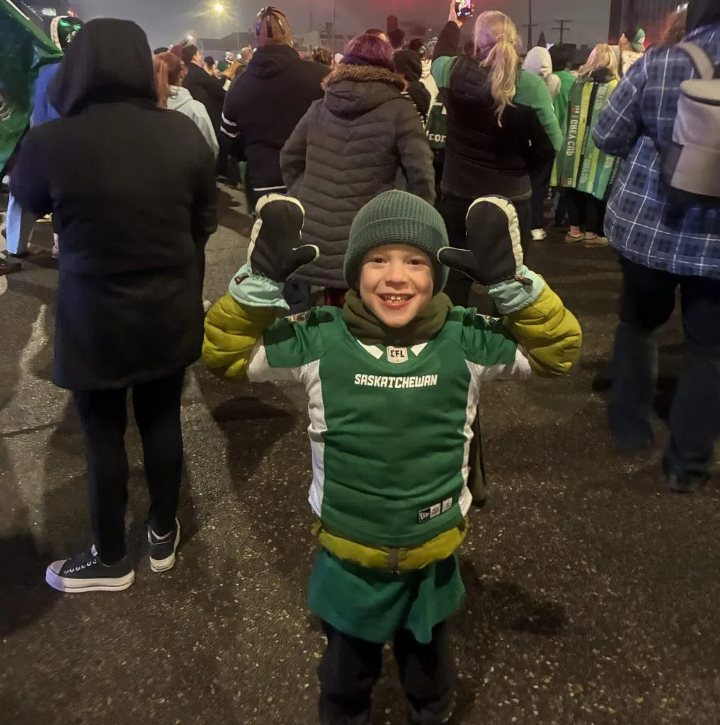 Six-year-old Linden Wood celebrates the Riders' Grey Cup win on the "Green Mile" in Regina. (Submitted)