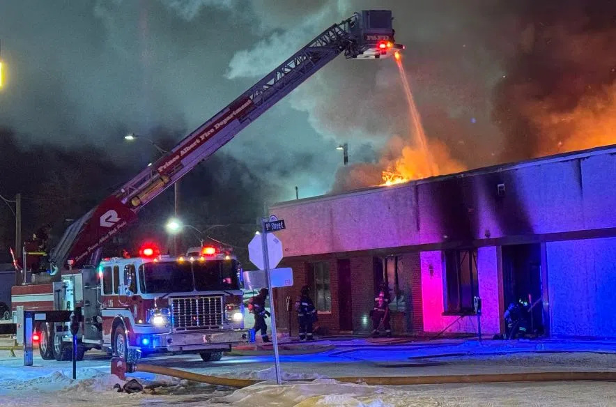 An intense fire engulfs the roofline of the Salvation Army building in Prince Albert on Christmas night, forcing emergency crews to close nearby streets as they battle the blaze. (Nigel Maxwell / paNOW)