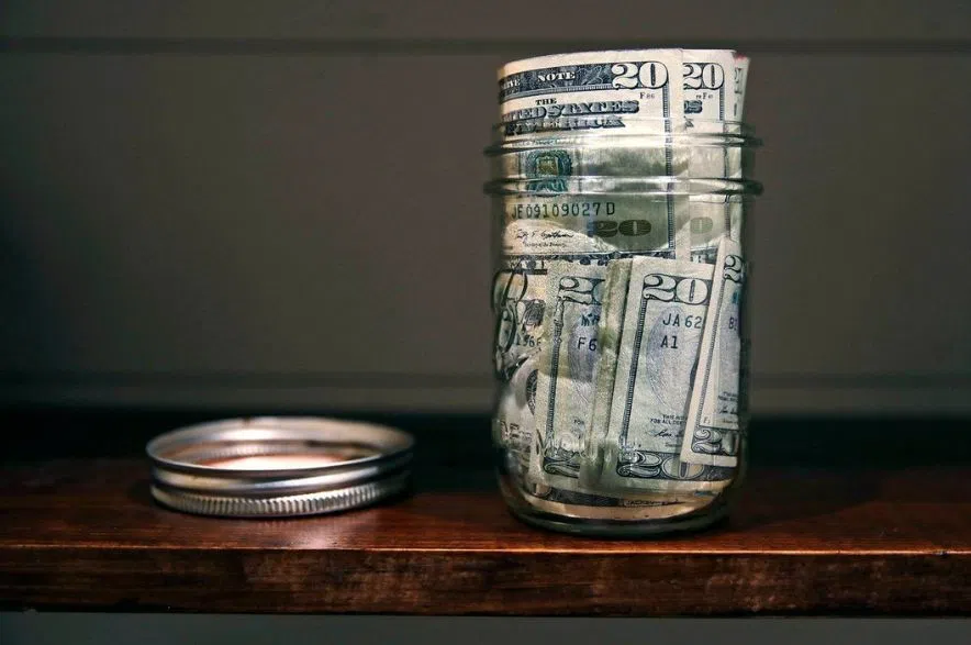 glass jar full of American cash