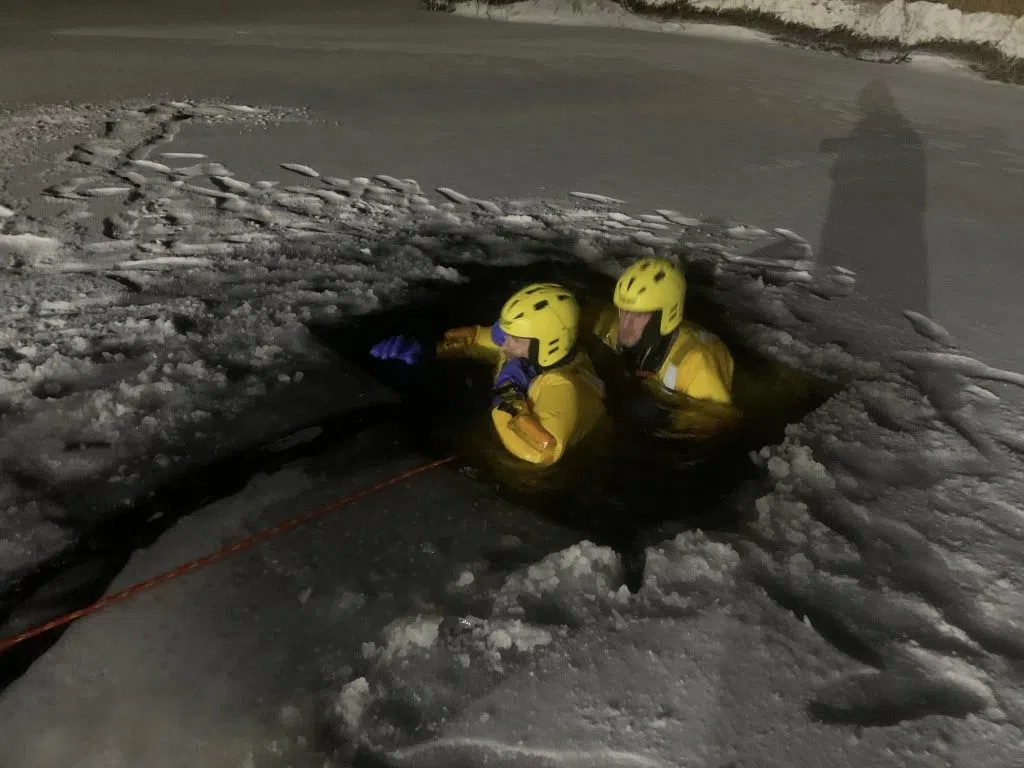 On a cold night in December, members of the Lumsden Fire Department practiced "low personnel ice rescue drills." (Lumsden Fire Department/Facebook)