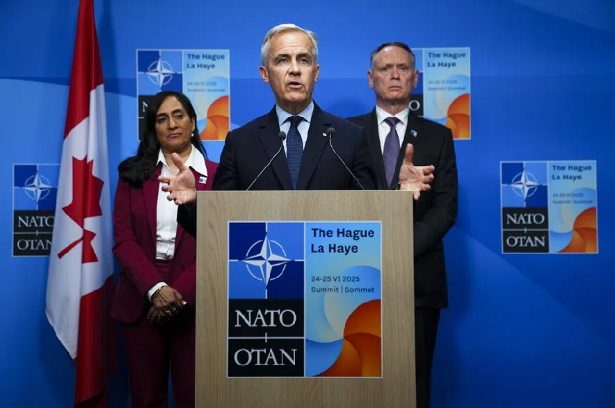 Prime Minister Mark Carney holds a closing press conference with Minister of Foreign Affairs Anita Anand, left and Minister of National Defence David McGuinty following the NATO Summit in The Hague, Netherlands on Wednesday, June 25, 2025.