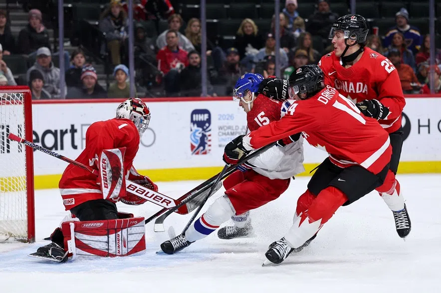 Czechia forward Vojtech Cihar (15) scores a goal past Canada goalie Jack Ivankovic (1) during the third period of an IIHF World Junior Hockey Championship semifinals game, Sunday, Jan. 4, 2026, in St. Paul, Minn.