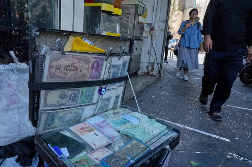 Current and pre-revolution Iranian banknotes.